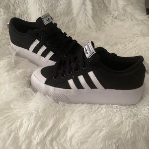 Adidas black and white platform sneaker